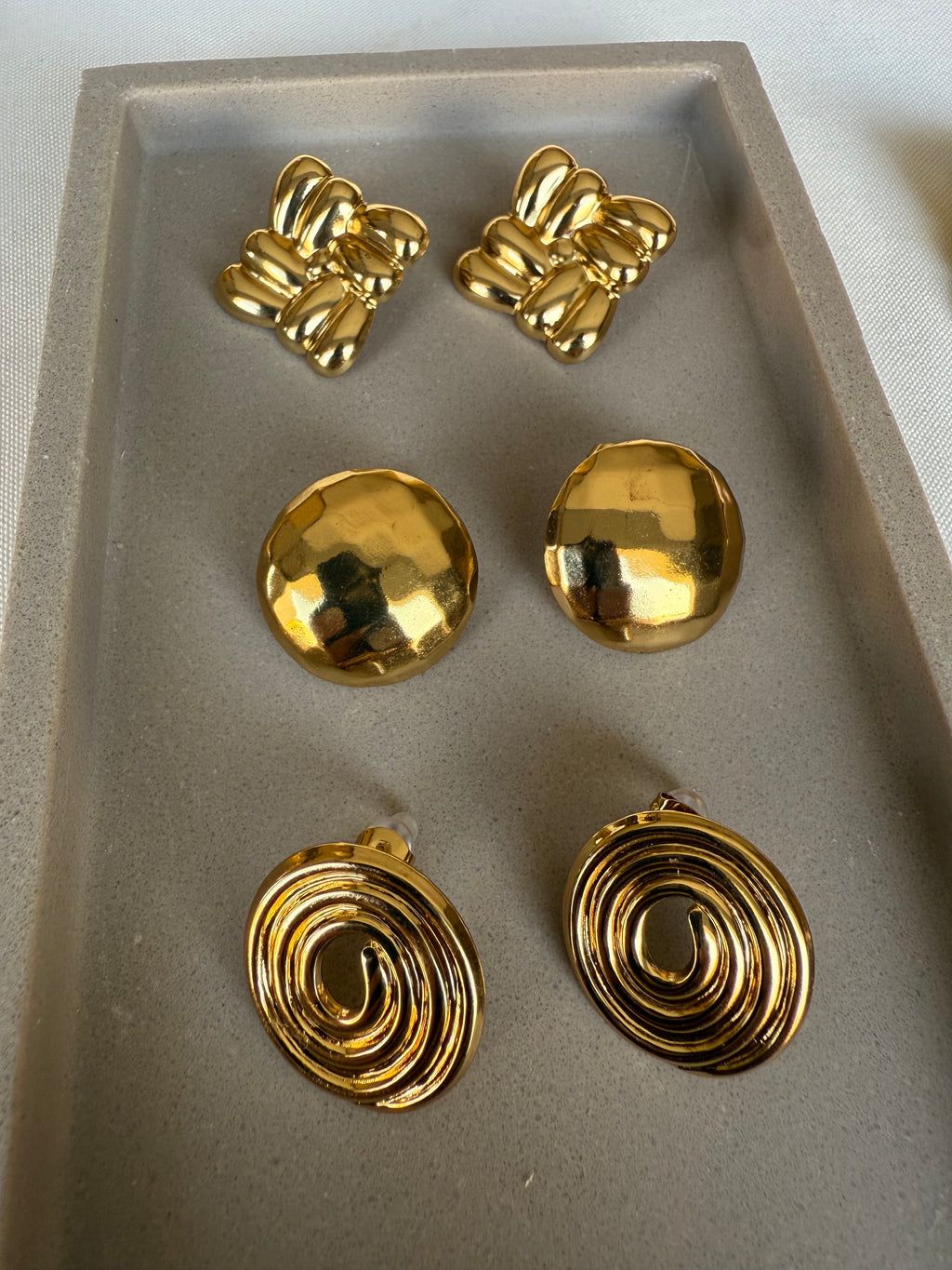 Aretes cinnamon roll